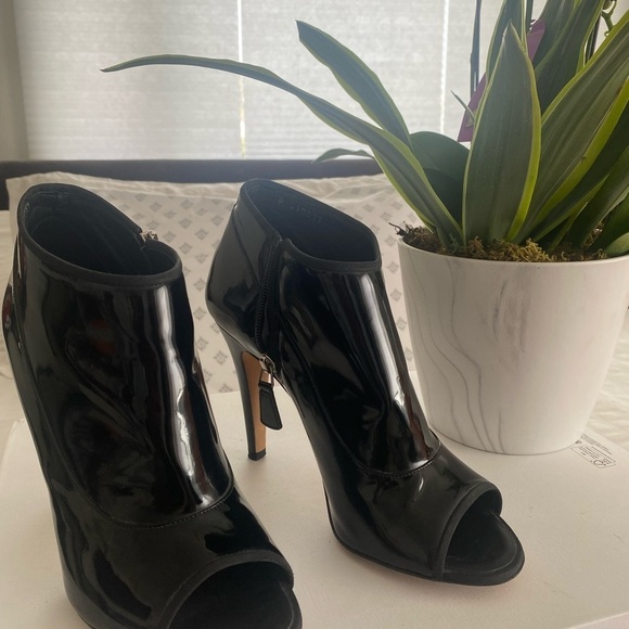 Authentic Chanel Patent Leather Peep Toe Booties
Size: 40 - Picture 5 of 12
